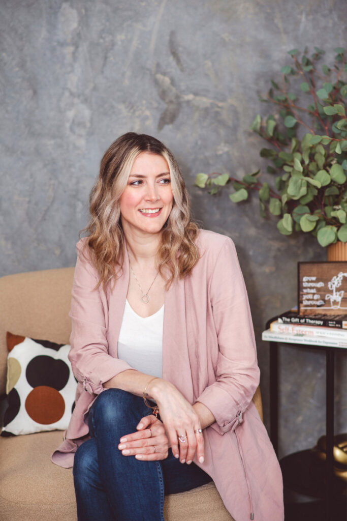 Woman smiling during therapy for stress management session in calm counselling space with natural decor