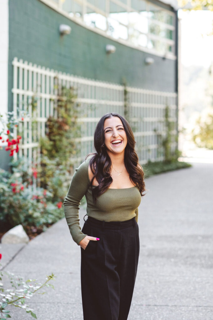Smiling woman representing hope while discussing the mental load in relationships and emotional well-being.