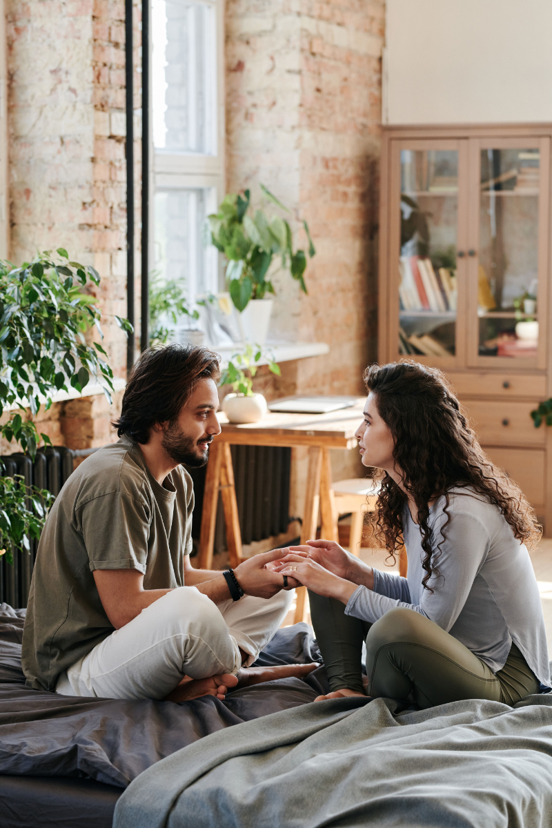 Couple having a meaningful conversation at home, showing emotional connection and intimacy in relationships.
