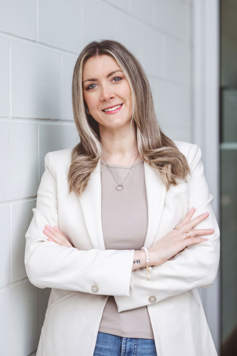 Registered clinical counsellor smiling, offering compassionate support to help people recover from burnout.