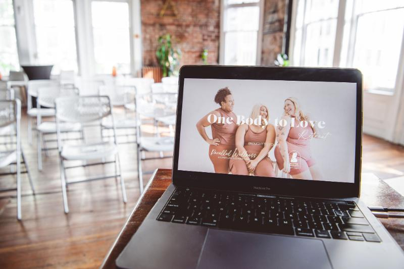 Laptop displaying the One Body to Love program, offering support for eating disorder recovery.